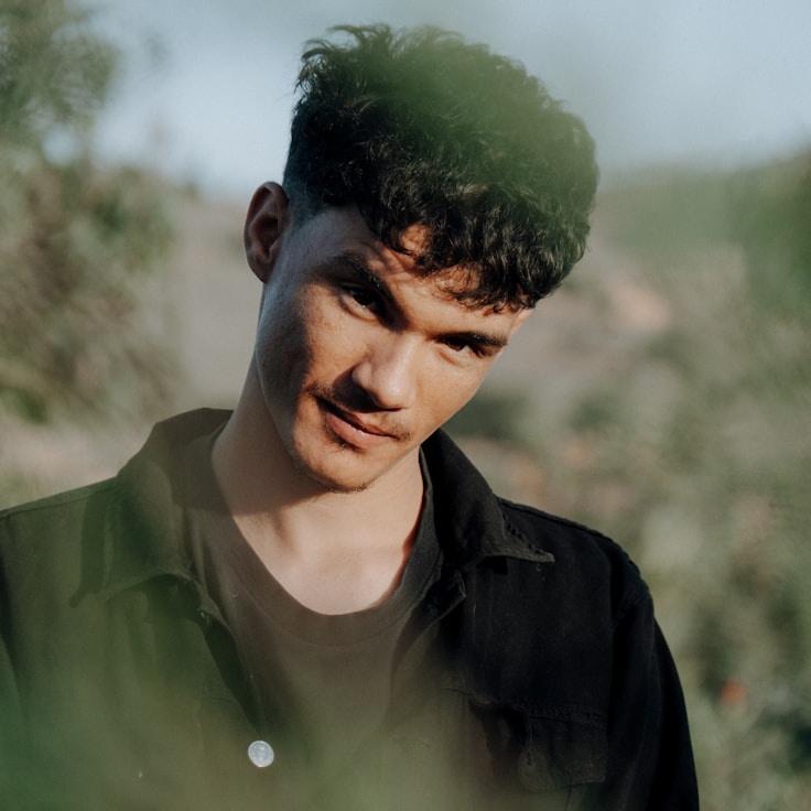 Asha Malhotra, Lead Design Curator at ShiftForgePro, reviewing corporate floral arrangements